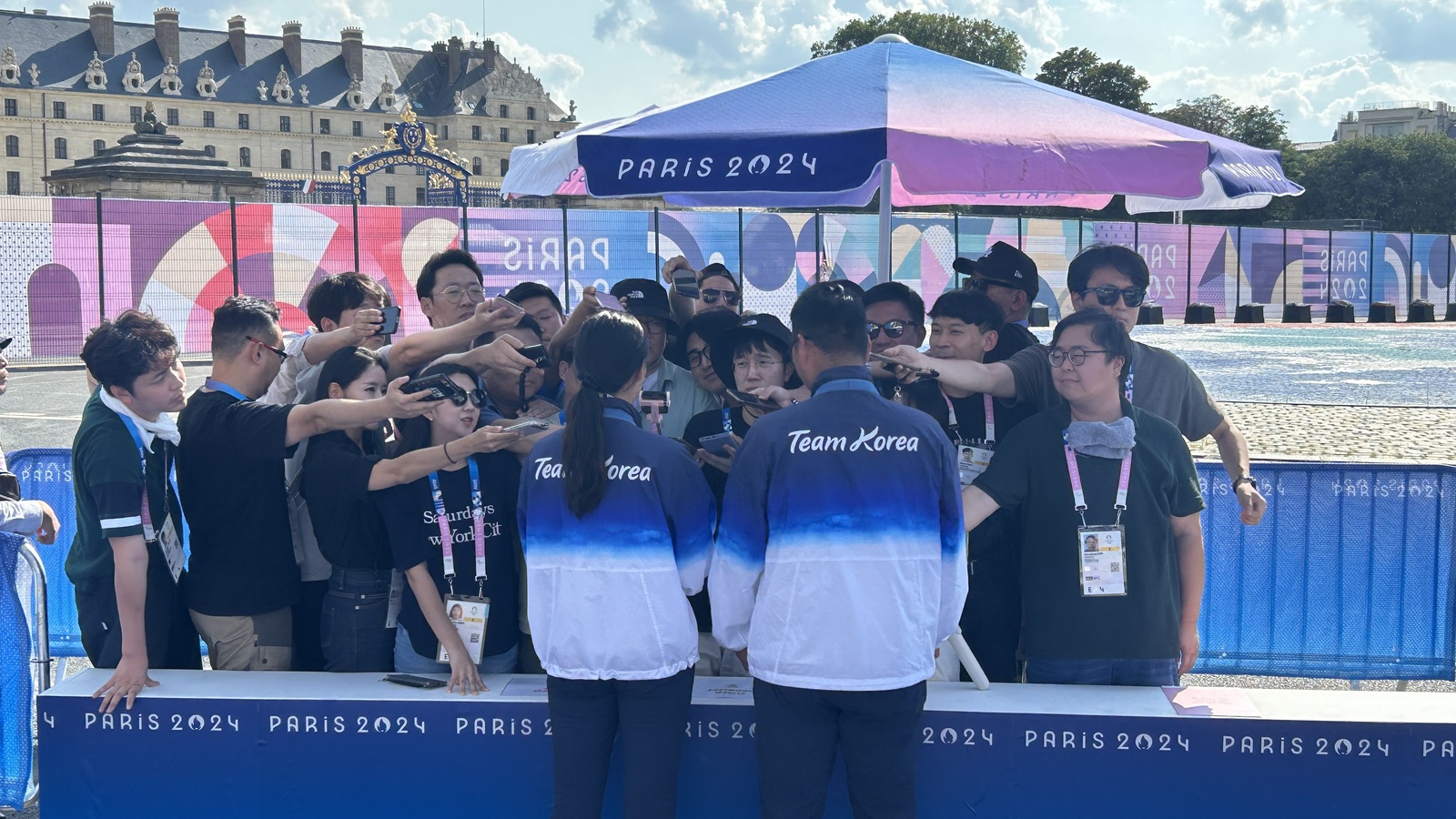 Korean archers being interviewed in the mixed zone