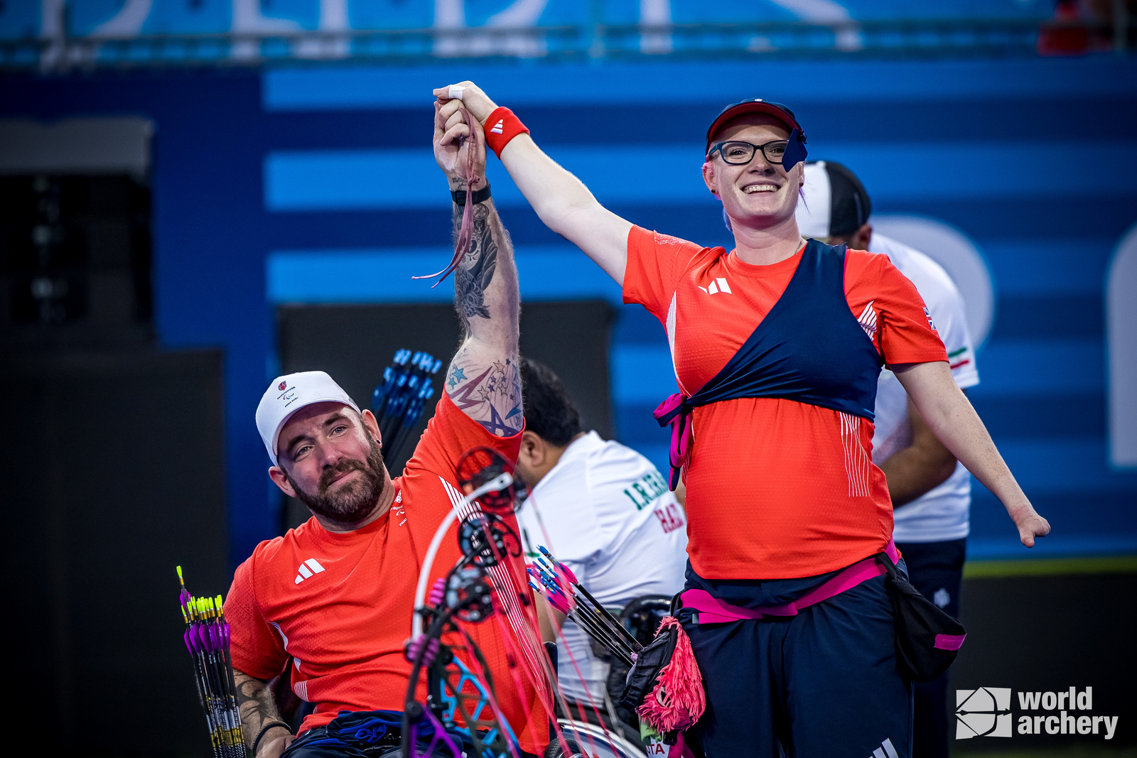 Nathan Macqueen and Jodie Grinham after winning gold at the Paris 2024 Paralympic Games