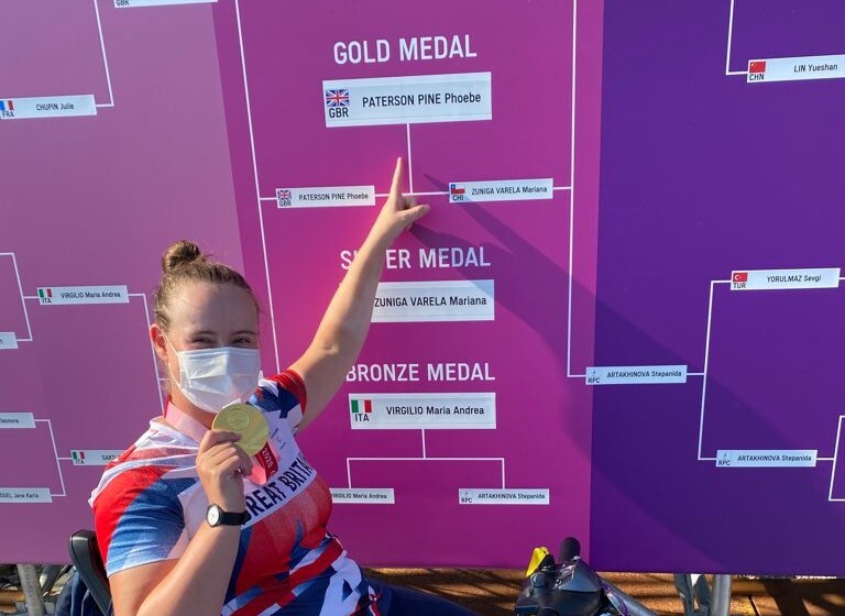 Phoebe Paterson Pine holding her gold medal at Toyo 2020